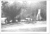 Black and white image of fire damaged home