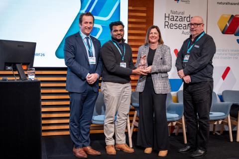 CEO Andrew Gissing; Postgraduate Student Award winner Sathurshan Mathavanayakam from Queensland University of Technology, Minister for Emergency Management the Hon Kristy McBain MP; and Centre Board Member Adj Prof Tim Moltmann during the awards ceremony at NHRF26.